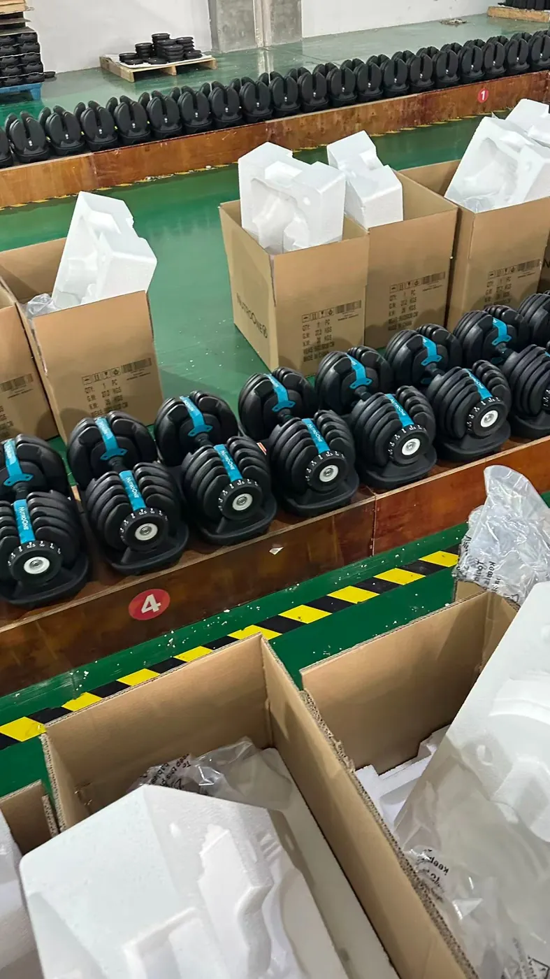 Adjustable dumbbells prepared for packing